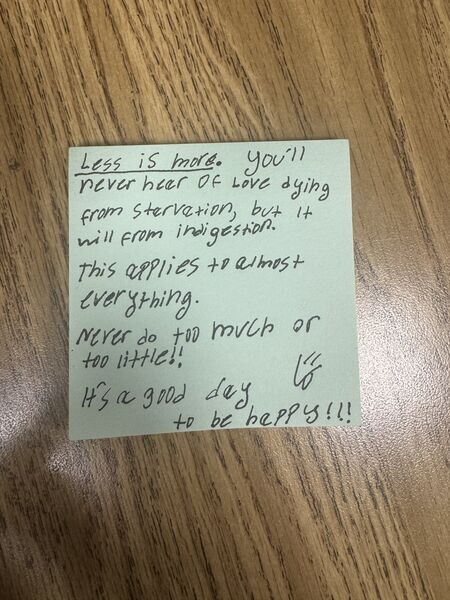 Handwritten sticky note with words of encouragement